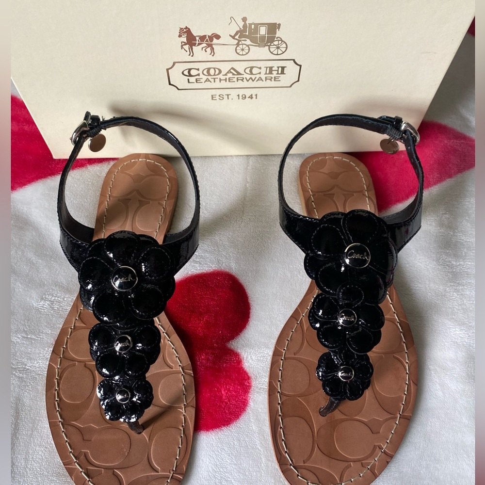 These are barley worn Coach Sandals. They have a decorative flowers on the top.
